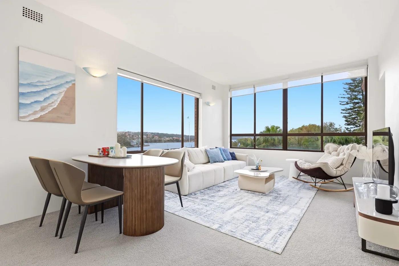 Bright apartment living room with water outlook photographed for a premium Sydney listing