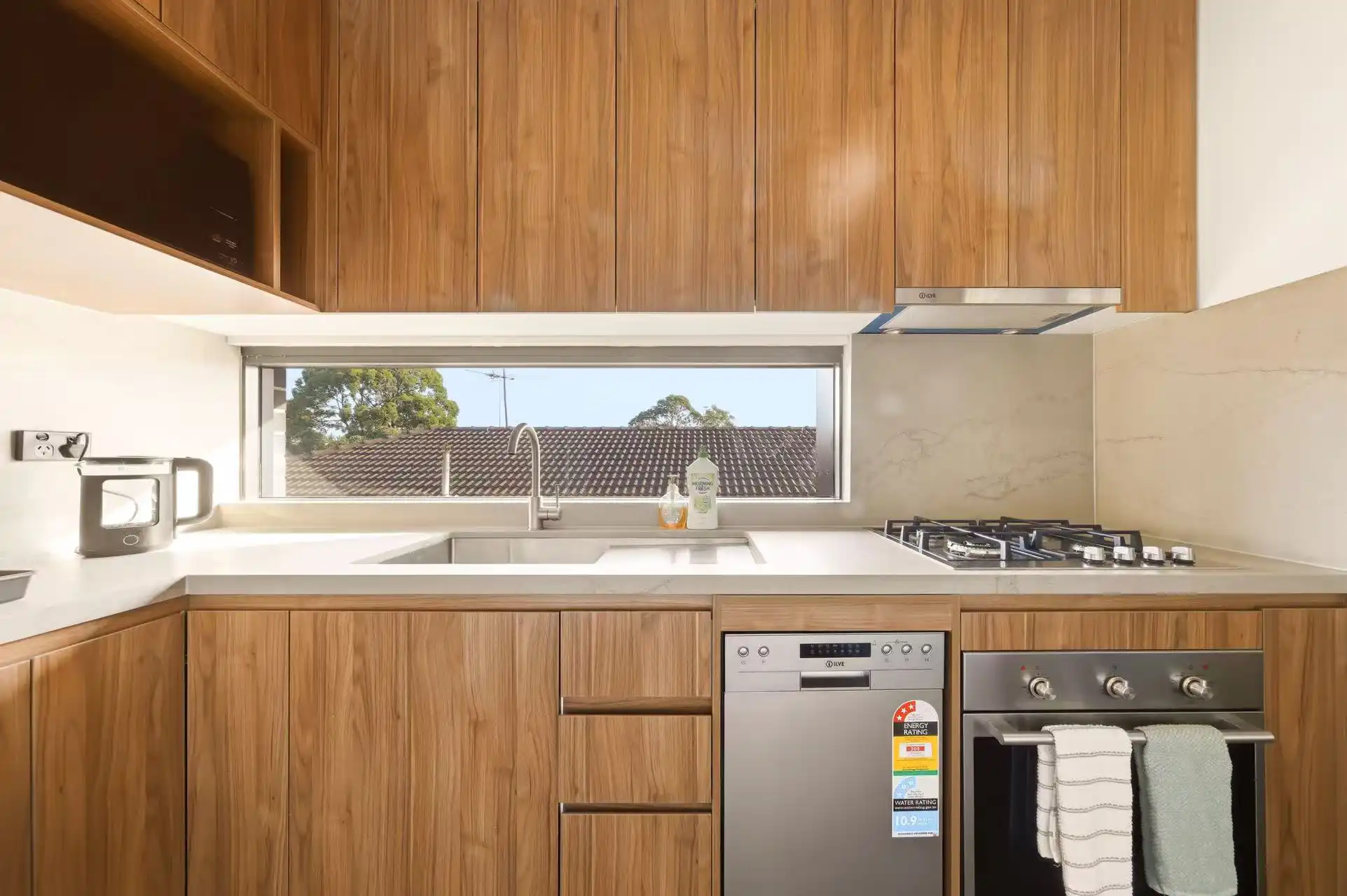 Clean short-stay kitchen photographed to build guest confidence